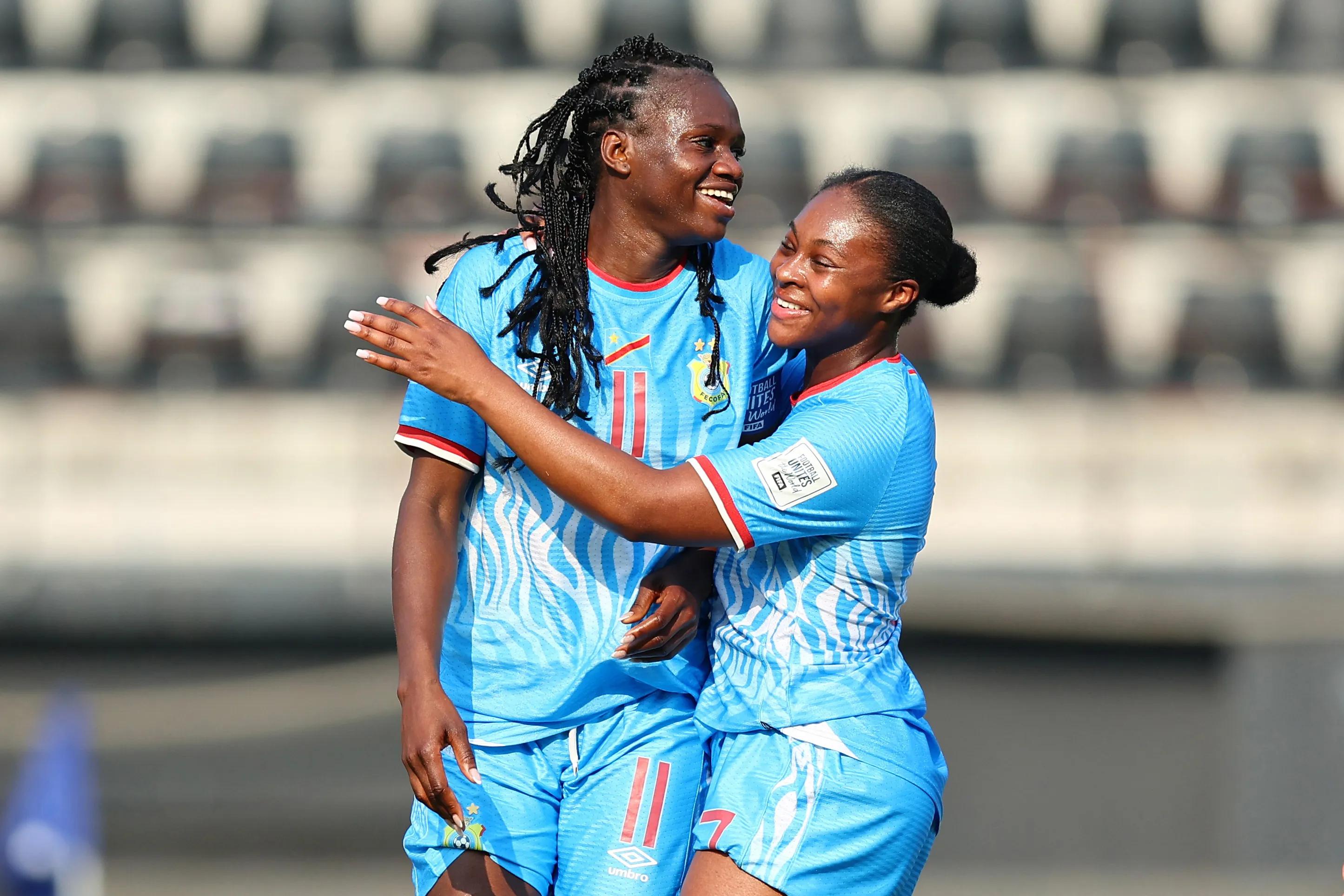 RATCHABURI, THAILAND - APRIL 12: Flavine Mawete (L) of Congo DR celebrates with teammate Esther Buabadi (R) after scoring the team's second goal during the FIFA Series 2026 match between Indonesia and Congo DR at Ratchaburi Stadium on April 12, 2026 in Ratchaburi, Thailand.  (Photo by Pakawich Damrongkiattisak - FIFA/FIFA via Getty Images)